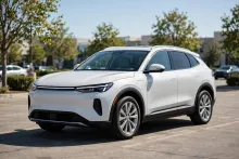 White sedan on a sunny car lot — MilitaryCarLot.com weekly featured vehicle